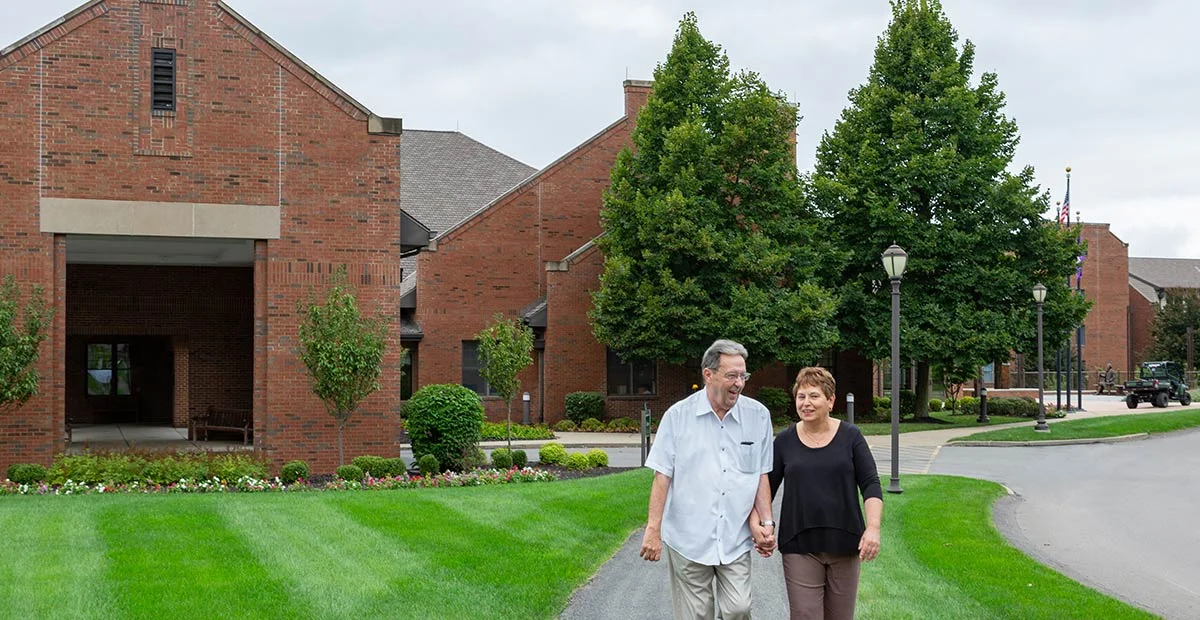 Senior couple holding hands while enjoying the outdoors at Masonic Village at Sewickley.