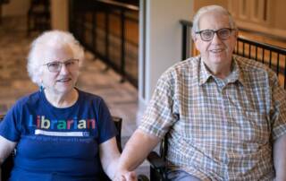 couple sitting in hallway together