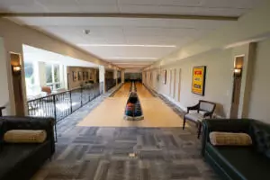 Wideshot of bowling alley with couches