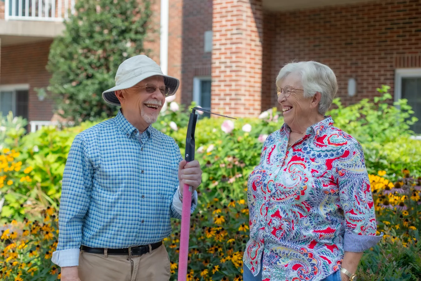 Man and woman gardening together outdoors