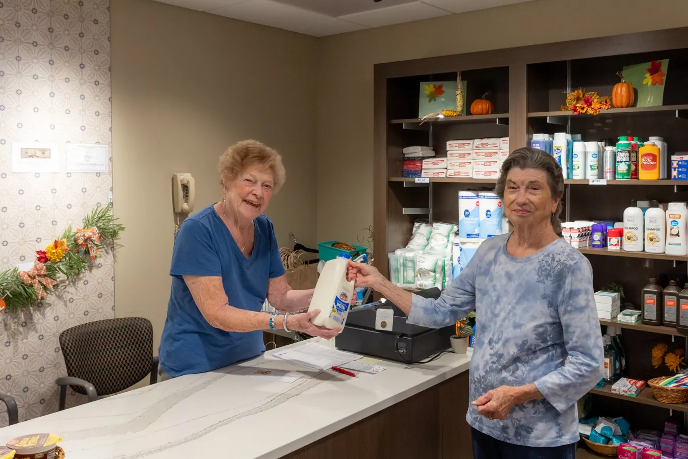 Woman purchasing milk in gift shop
