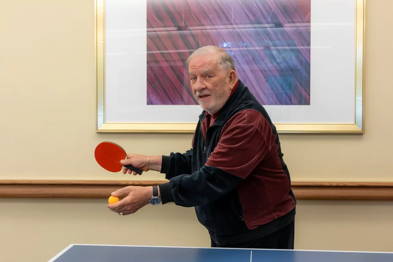 Man getting ready to serve while playing pingball