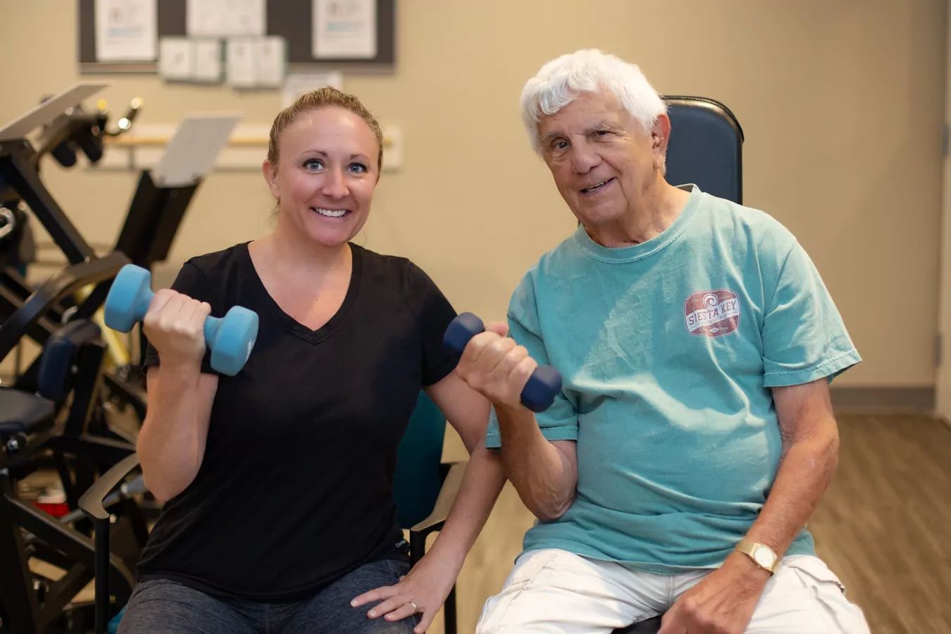 Man lifting weights with staff