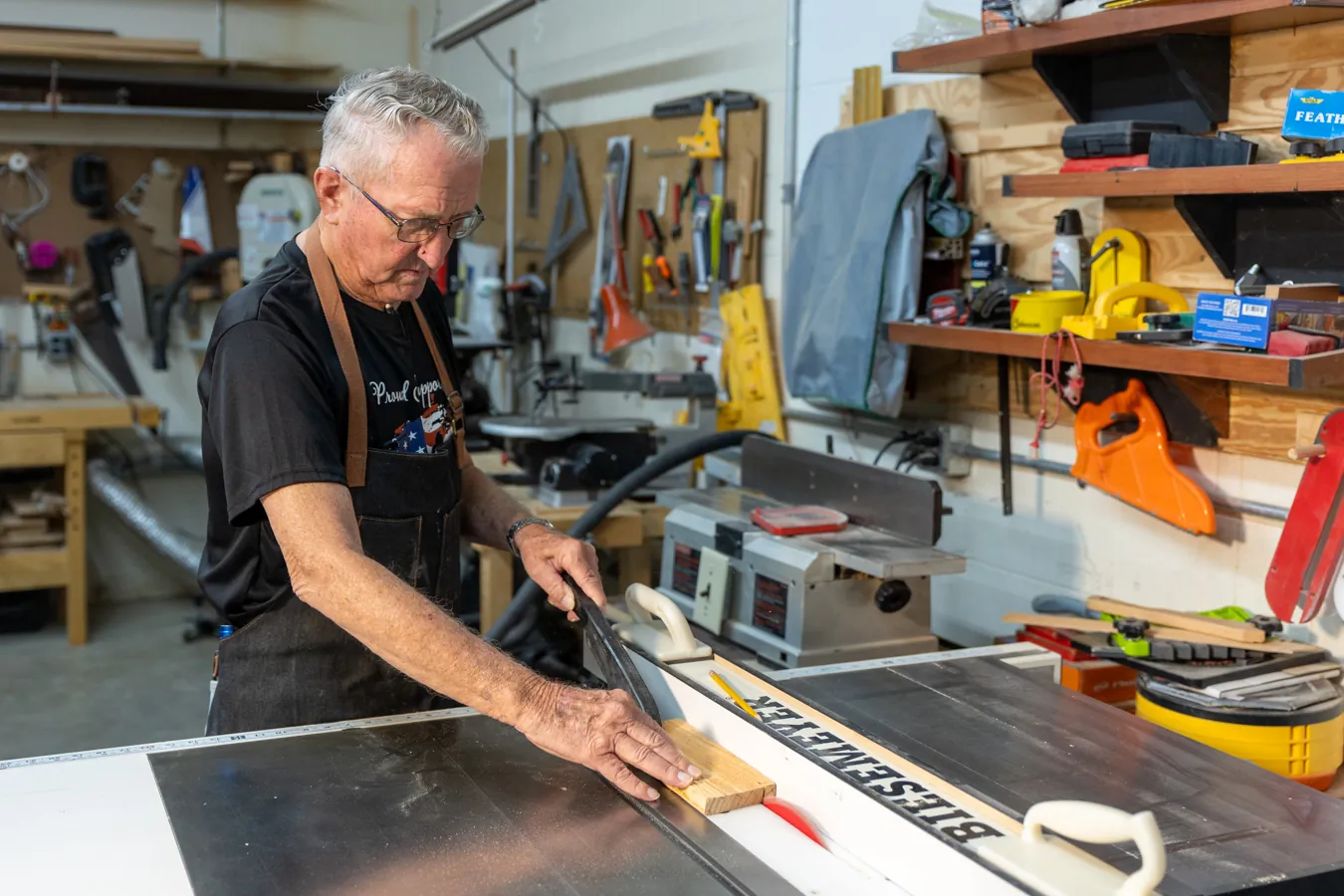 Man working with tools in wood shop