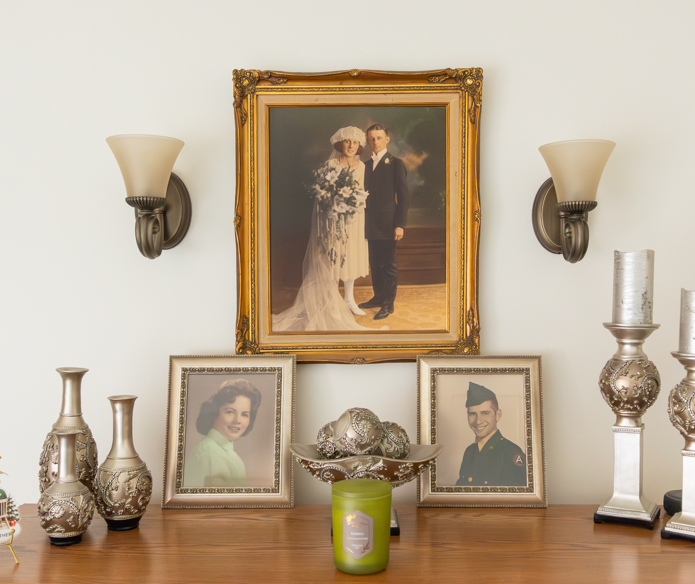 9I4A0398 Top of dresser with old family photos and vases.